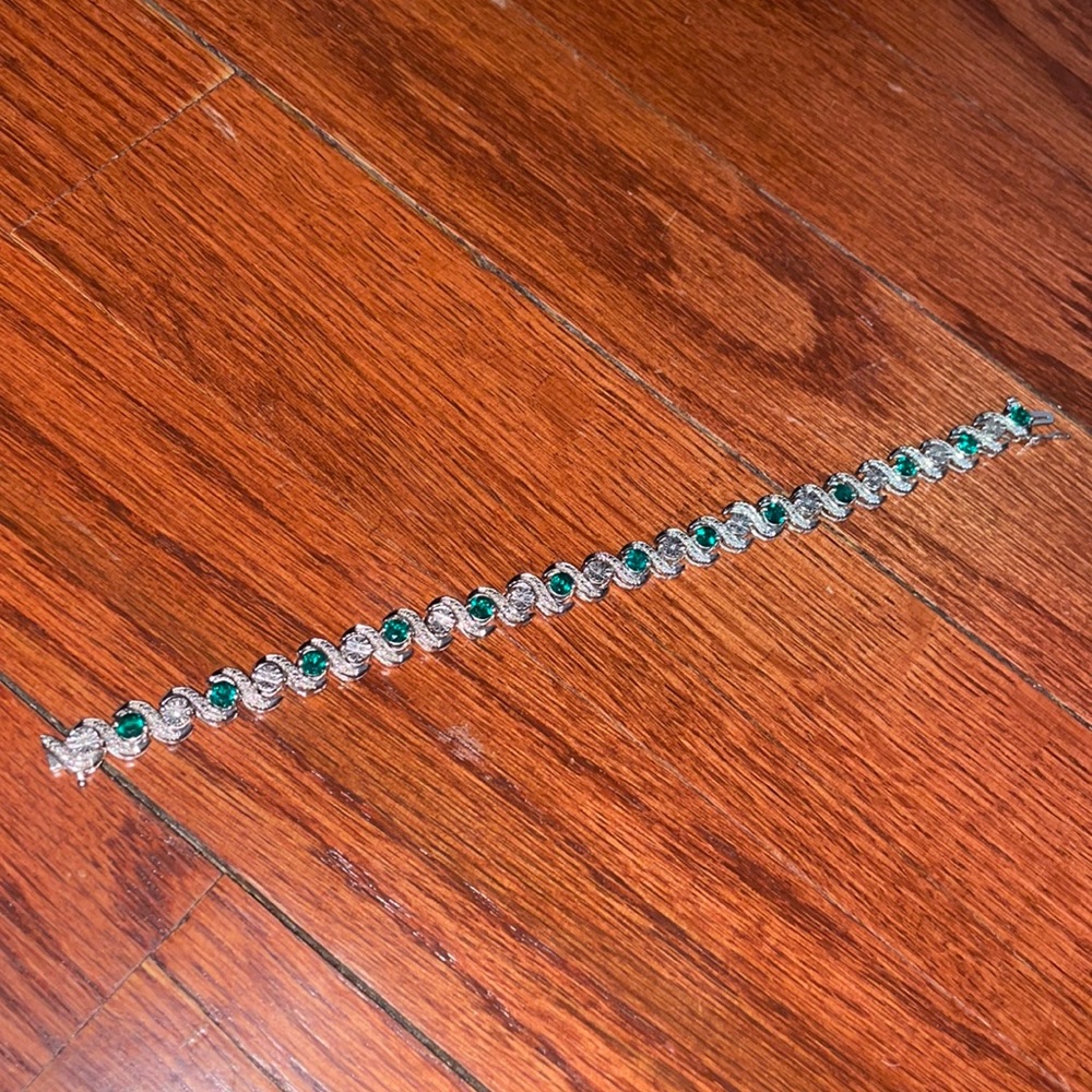 Emerald and 1/8 CT. T.W. Diamond Tennis Bracelet